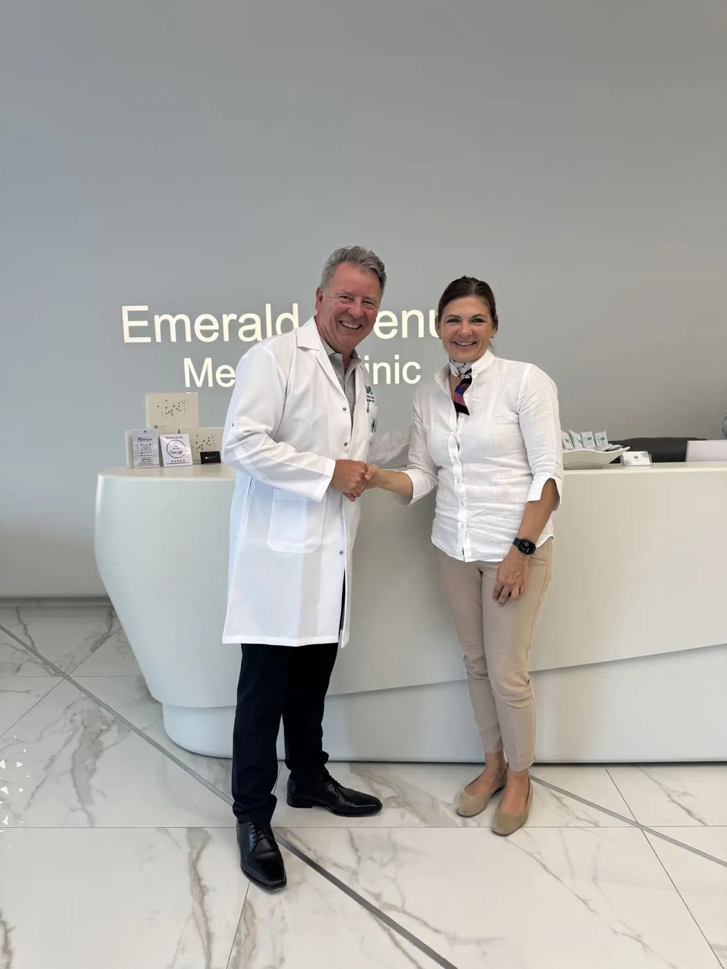Viktoria Eliseeva-Amon with a doctor at a partner clinic