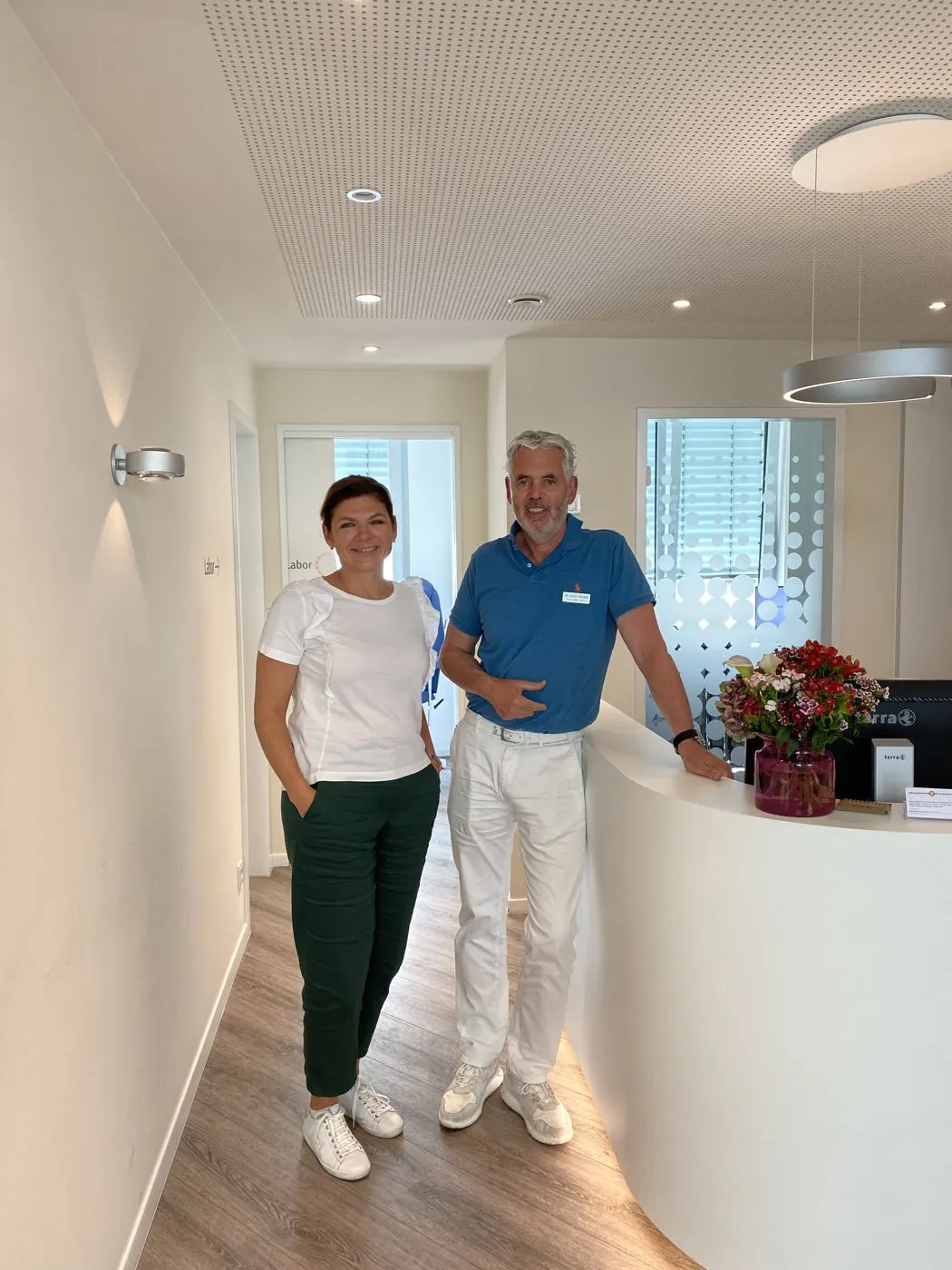 Viktoria Eliseeva-Amon with a doctor at a partner clinic